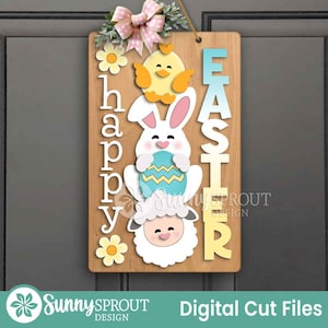 May include: Wooden Easter sign with a chick, bunny, and lamb design. The sign says "happy" vertically on the left and "EASTER" vertically on the right. The sign is decorated with flowers and a pink bow.