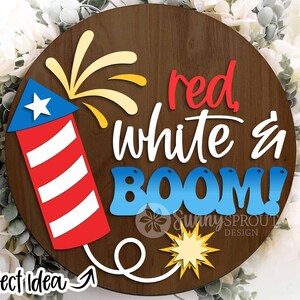 May include: A wooden round sign with the text "red, white & BOOM!" in red, white, and blue lettering. A red, white, and blue firework is on the left side of the sign.
