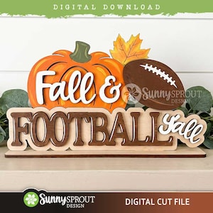 May include: A layered wooden sign featuring an orange pumpkin, a brown football, and a yellow maple leaf. The text reads Fall & FOOTBALL y'all. The design is mounted on a flat base, with a light wood finish and dark brown lettering accents.