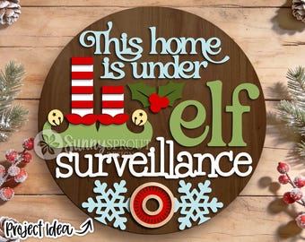 This Home Under Elf Surveillance Sign, Digital Download, SVG Laser Cut File, Cricut, Round Door Hanger Design, Funny Christmas Decor