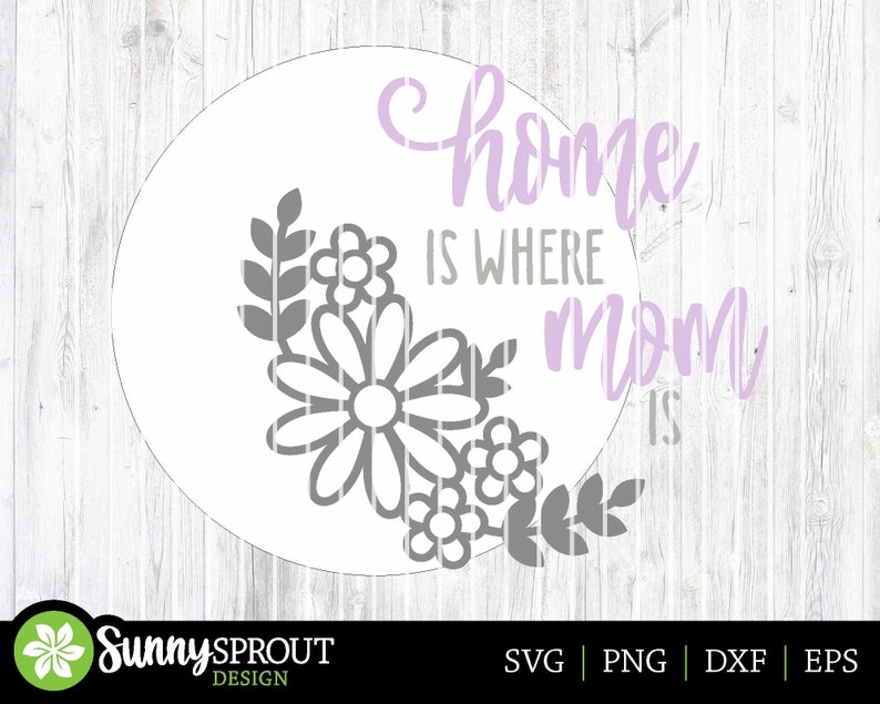 May include: A white circle with a floral design and the text "home is where mom is" in purple and gray lettering.
