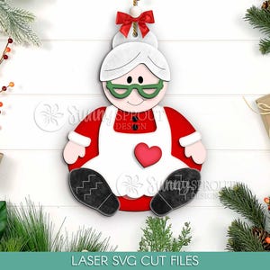 座っているサンタクロースのクリスマスオーナメントファイル、デジタルダウンロード、SVGレーザーカットファイル、ホリデーギフトSVG、クリスマスツリーオーナメントSVG、北極