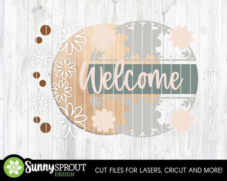 May include: A round wooden sign with the word "Welcome" in cursive, set against a light green and tan background. The sign is decorated with white and peach-colored flower cutouts and brown dots. The Sunny Sprout Design logo is at the bottom.