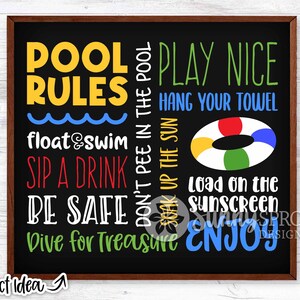 May include: A framed chalkboard sign with pool rules in multiple colours. Text includes "Pool Rules," "Play Nice," "Float & Swim," "Sip a Drink," and "Be Safe." A colourful inflatable ring is also shown.