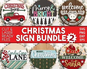 May include: A set of six Christmas sign designs featuring a red truck with Christmas trees, a moose with the text "Welcome", a candy cane lane sign, a sign with the text "Merry Christmas", a sign with the text "Merry & Bright", and a sign with the text "Welcome Santa".