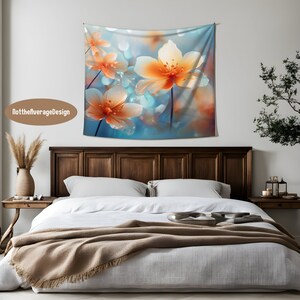 May include: A tapestry featuring a close-up of delicate, orange and white flowers with a soft, blue and white background. The flowers have a blurred, dreamy effect, creating a romantic and ethereal atmosphere.