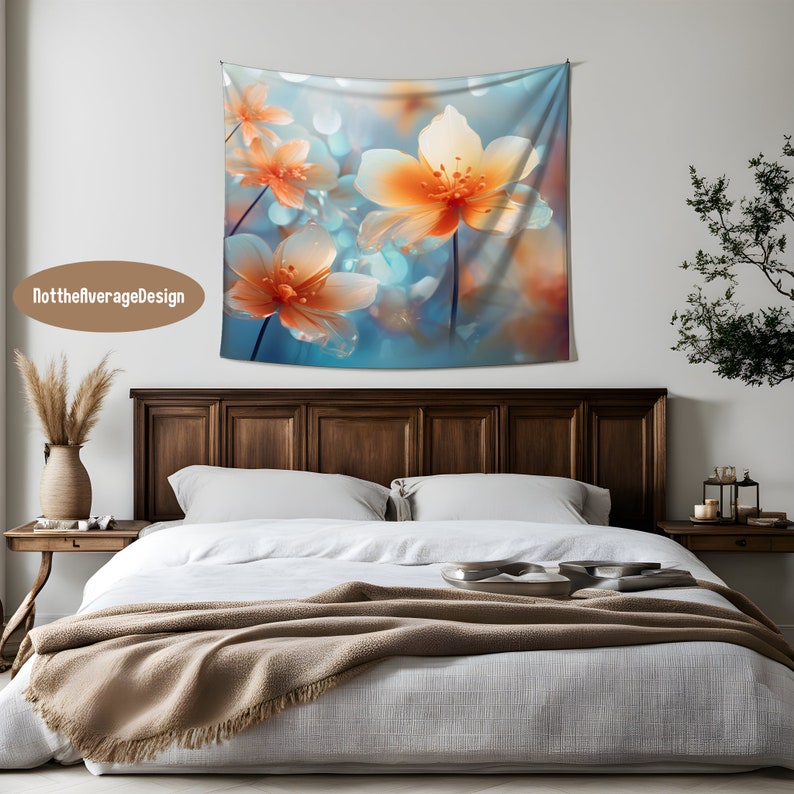 May include: A tapestry featuring a close-up of delicate, orange and white flowers with a soft, blue and white background. The flowers have a blurred, dreamy effect, creating a romantic and ethereal atmosphere.