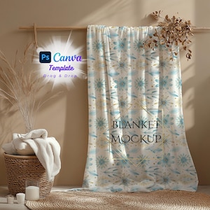 May include: A white blanket with a blue and gold floral pattern. The blanket is draped over a wooden rod and has the text "BLANKET MOCKUP" printed on it.