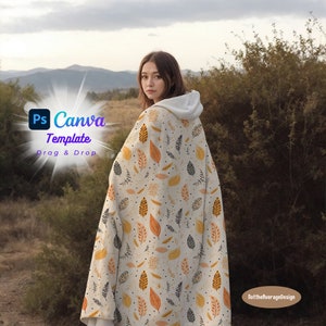 Puede incluir: Una mujer con una sudadera con capucha blanca y una manta con un patrón de hojas naranjas, amarillas y negras. La manta tiene un fondo blanco con pequeños puntos dorados. El texto "Ps Canva Template Drag & Drop" está en la esquina superior izquierda de la imagen. El texto "NottheaverageDesign" está en la esquina inferior derecha de la imagen.