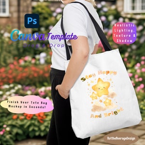 May include: A white tote bag mockup with a yellow star design and the text "Stay Happy And Bright". The bag is being held by a person in a white shirt and black pants.