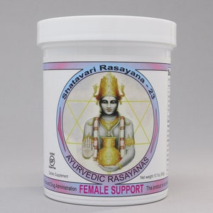 May include: White plastic container with a pink and blue label. The label features a drawing of a person in a golden crown holding a golden pot. The label reads "Shatavari Rasayana - 23 Ayurvedic Rasayanas Female Support Net weight 10.7oz (300g) This product is not a drug. Certified Gluten Free Dietary Supplement."