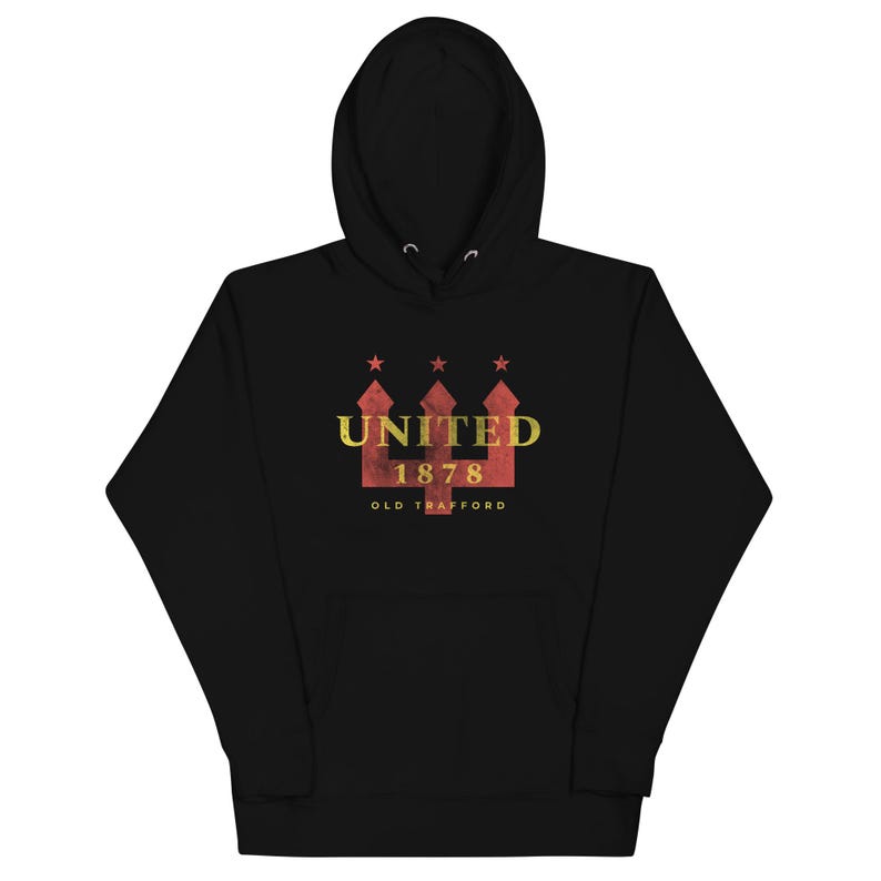 May include: Black hooded sweatshirt with a front graphic. The graphic features the word "UNITED" above the number "1878" and the words "OLD TRAFFORD" in a distressed style. The graphic is in red and gold.