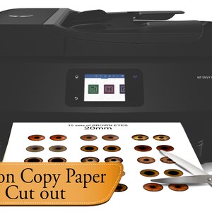 May include: A black HP Envy Photo 7804 printer with a sheet of paper in the output tray. The paper has 10 sets of brown eyes printed on it, each measuring 20mm. The text "Print on Copy Paper & Cut out" is visible in the lower left corner of the image.