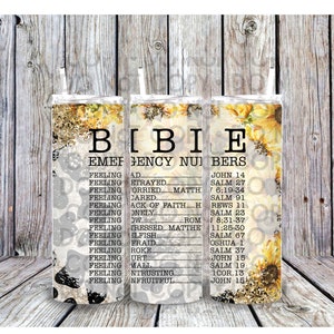 May include: A set of three stainless steel tumblers with a floral design and the words "Bible Emergency Numbers" printed on them. The tumblers are decorated with sunflowers and glitter.