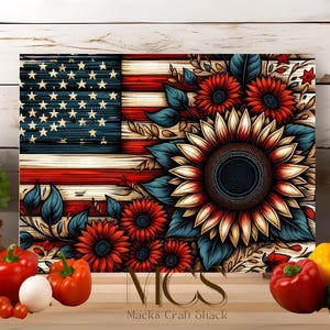 May include: A cutting board with a patriotic design featuring a red, white, and blue American flag with sunflowers and blue leaves. The text "Macks Craft Shack" is at the bottom of the board.