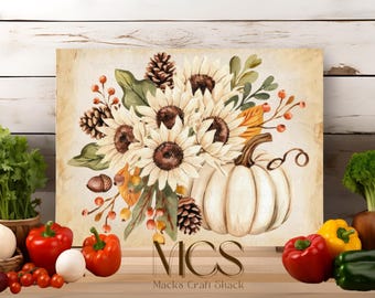 May include: A watercolor painting of a white pumpkin with sunflowers and fall foliage. The pumpkin is surrounded by sunflowers, pine cones, and red berries. The background is a light beige color. The text "MICS Mack's Craft Shack" is at the bottom of the image.