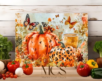 May include: A watercolor painting of pumpkins, butterflies, and a cup of coffee. The pumpkins are orange and brown with a leopard print design. The butterflies are orange and black. The coffee cup is brown and white.