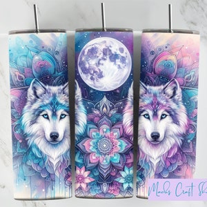 May include: Three 20 oz stainless steel tumblers with a wolf, moon, and mandala design. The wolf is white with blue and purple accents. The moon is white with a blue and purple background. The mandala is pink, blue, and purple. The tumblers are perfect for everyday use.