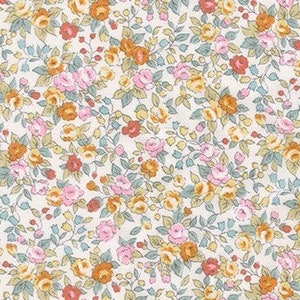 May include: A white fabric with a repeating pattern of small pink, orange, and yellow flowers on a white background.