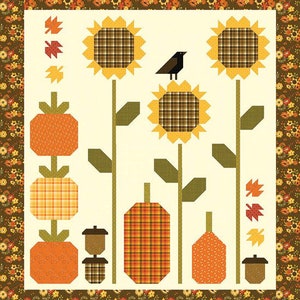 May include: A white background with three sunflowers, each with a brown and yellow plaid centre.  There are three pumpkins, each with a different plaid pattern.  A small black bird sits on top of one of the sunflowers.  The background is a brown and orange floral pattern.