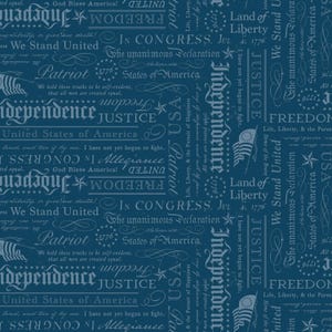 May include: Dark blue fabric with a repeating pattern of patriotic text and imagery. The design includes words like "Freedom," "Justice," and "Independence," along with the American flag and stars. The text is in a stylized, vintage font.