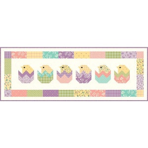 May include: A colorful patchwork quilt with a border of floral and geometric patterns. Five yellow chicks are peeking out of pastel-colored eggs in the center of the quilt.