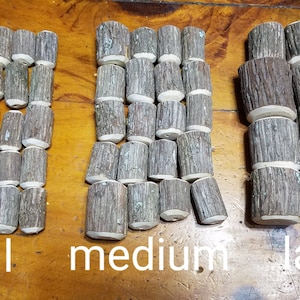 May include: Three groups of wooden log slices, arranged in rows from smallest to largest, labeled "small", "medium", and "large".