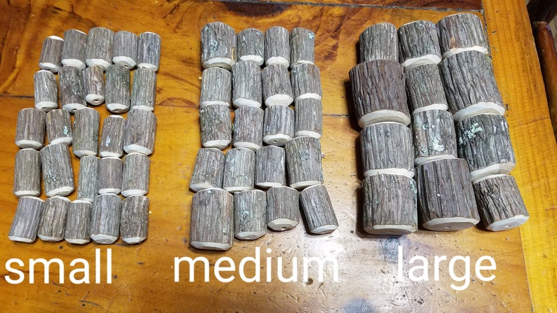 May include: Three groups of wooden log slices, arranged in rows from smallest to largest, labeled "small", "medium", and "large".