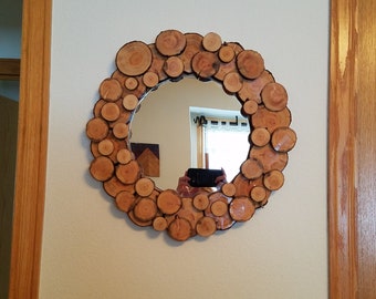 Wood slice wall mirror.  16”