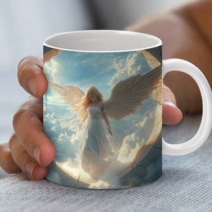 May include: White ceramic mug featuring a colourful image of an angel with wings outstretched, soaring through a cloudy sky.