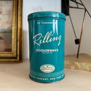 May include: Vintage teal metal container with the word "Rilling" in white script. The container also features the words "KOOLERWAVE" and "Rilling Company, New York, N.Y." in white text. A classic collectible.