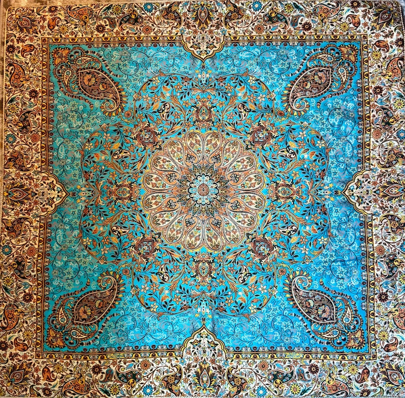May include: A blue and gold patterned rug with a central medallion design. The rug has a traditional Persian style with intricate floral and paisley motifs.