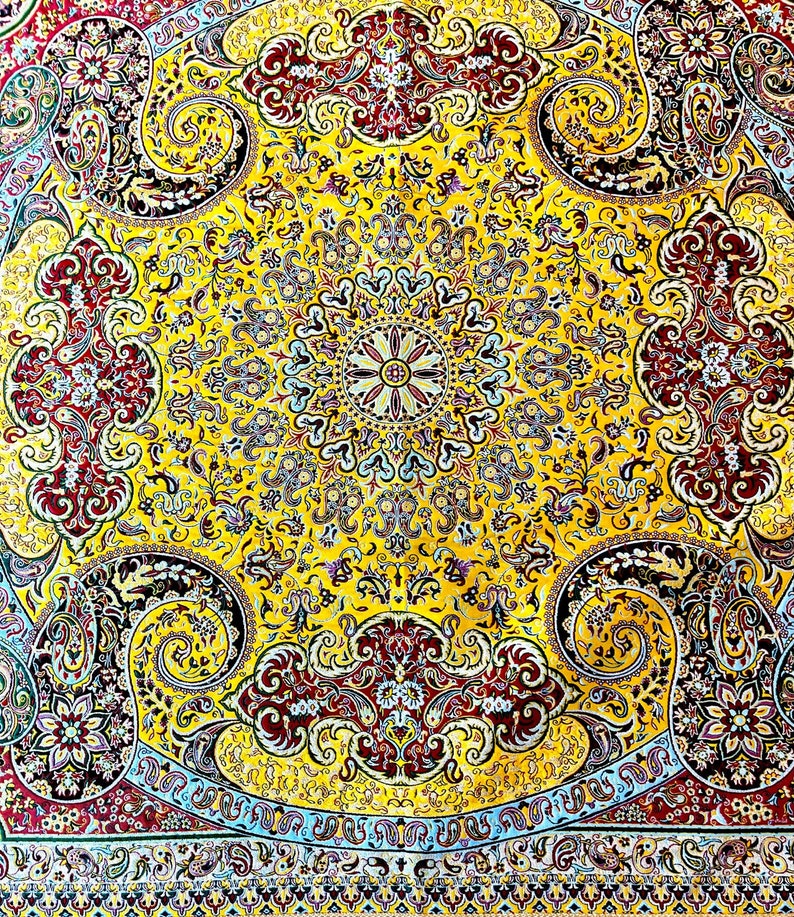 May include: A yellow, red, and blue patterned rug with a central medallion and paisley designs.