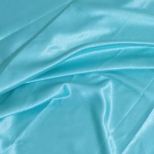 May include: A smooth, light blue satin fabric with soft folds and wrinkles.