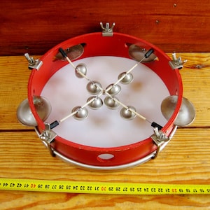 An old musical instrument, a tambourine. Wedding tool. Ritual instrument. Concert instrument. Music of shamans.