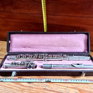 Vintage wind musical instrument from a military band - flute. Wind instruments. Military orchestral instruments. Antique gift.
