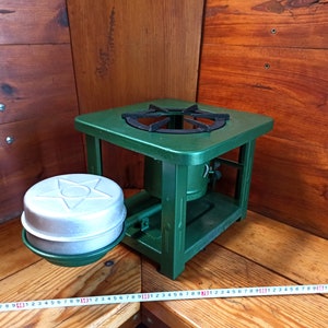 Vintage open fire cooking stove with one burner running on kerosene. An old tourist or village stove that runs on kerosene. An antique gift.