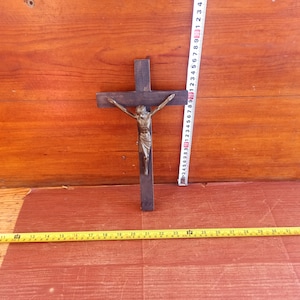 Vintage wall cross with crucifix, early 20th century. Historical artifact. Antique gift. A Christmas gift. Ancient cross. Jesus Christ.