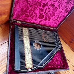 Vintage musical instrument - Zither. Concert instrument. Wedding instrument. Music of lovers. Stringed plucked instrument. Harp.