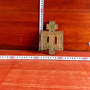 Vintage bronze cross with Jesus Christ crucifix and standing saints - 19th century. Russian Orthodox bronze cross with crucifix.