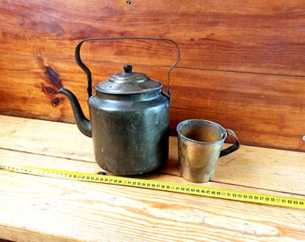 Vintage bronze teapot and mug from the early 20th century. Antique copper utensils. Antique gift. Antique dishes.