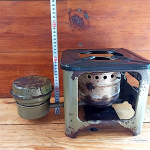 Vintage open fire cooking stove with one burner running on kerosene. An old tourist or village stove that runs on kerosene. An antique gift.
