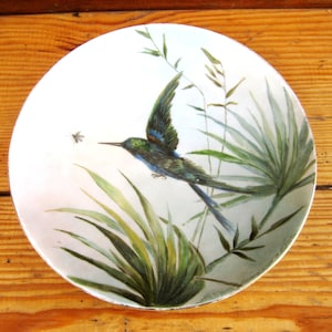 Antique wall plate &quot;Bird&quot; is hand-painted. Wall plate. Antique gift. An old porcelain plate.