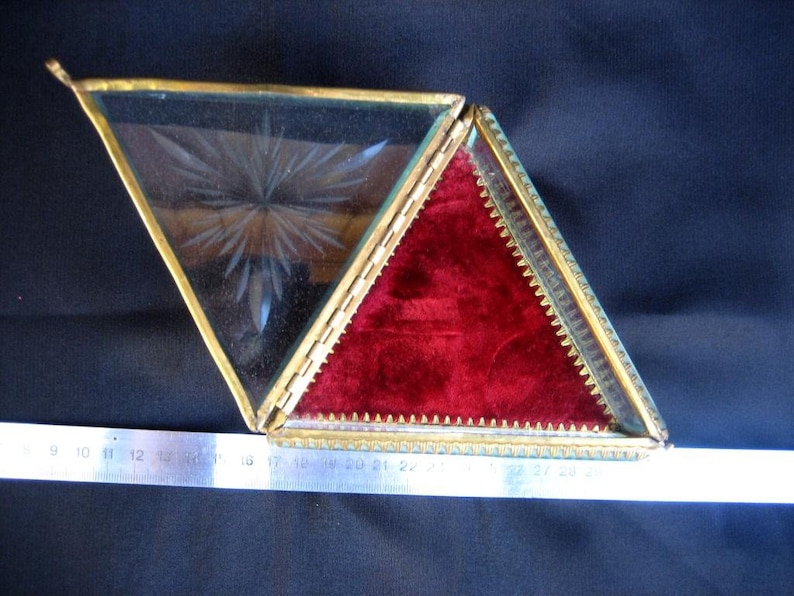 Antique French glass box for jewelry and small items from the early 20th century Collection of vintage jewelry boxes on the ladies/' table.