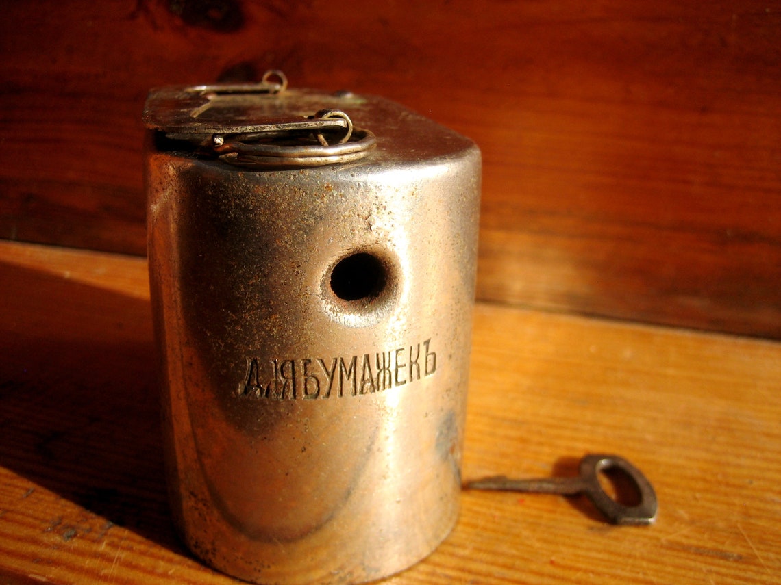 The old mechanical piggy bank of the Russian Empire with its Etsy