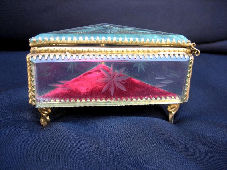 Antique French glass box for jewelry and small items from the early 20th century Collection of vintage jewelry boxes on the ladies/' table.