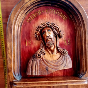 Vintage wood carved portrait of Jesus Christ. Historical artifact. Antique gift. Jesus Christ. Carved wooden icon.