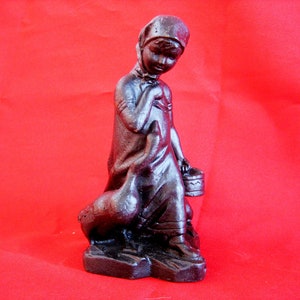 Vintage cast iron figurine - Girl with geese. Antique gift. Old figurine of a girl.