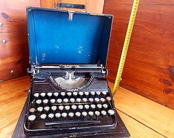 An old CONTENENTAL mechanical machine in its own suitcase. Historical artifact. Antique gift. Typewriters.