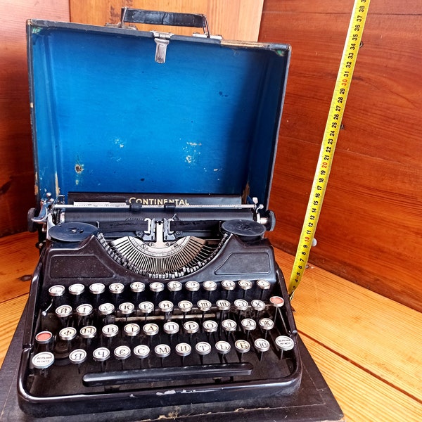 An old CONTENENTAL mechanical machine in its own suitcase. Historical artifact. Antique gift. Typewriters.